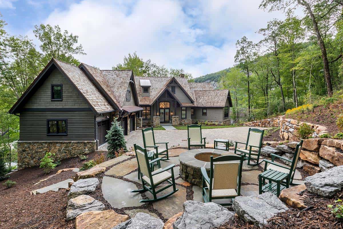 contemporary mountain home exterior with a patio and fire pit