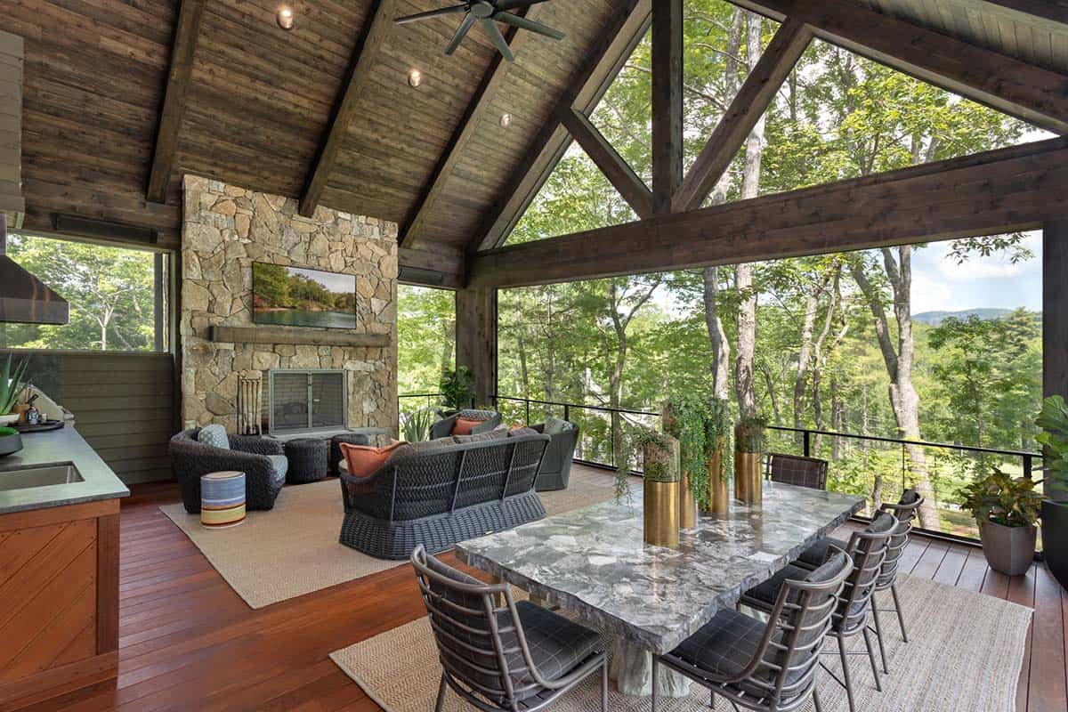 contemporary mountain home covered porch with outdoor furniture