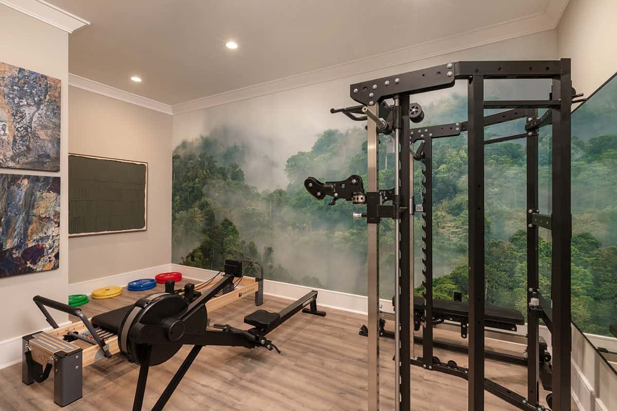 contemporary home gym with a wall mural