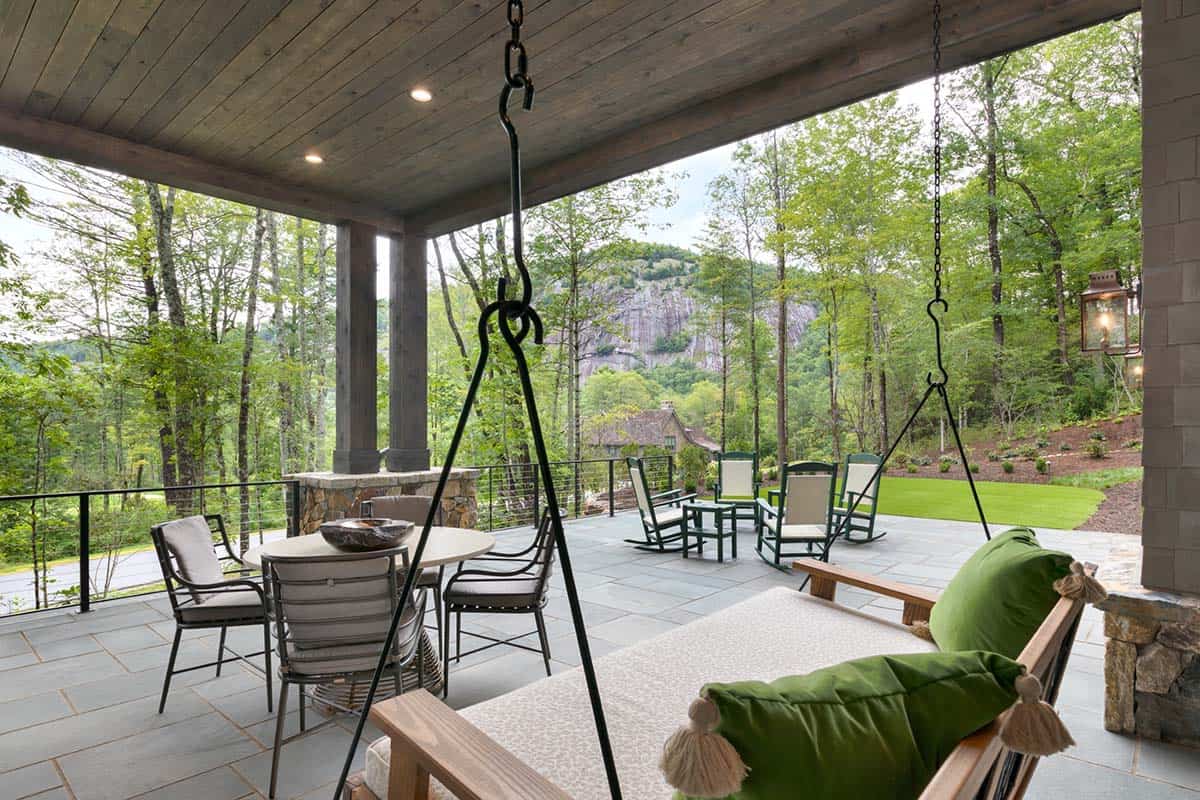 contemporary covered patio with a hanging daybed