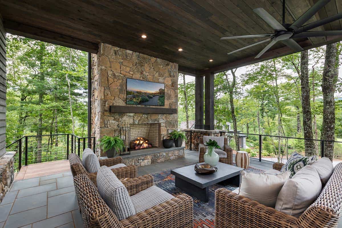 contemporary covered patio with a fireplace and outdoor furniture