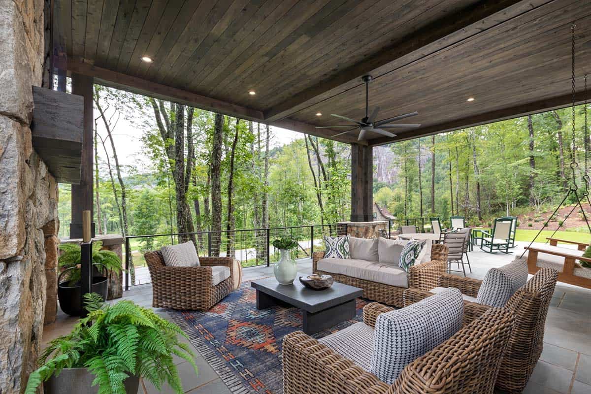 contemporary covered patio with a fireplace and outdoor furniture