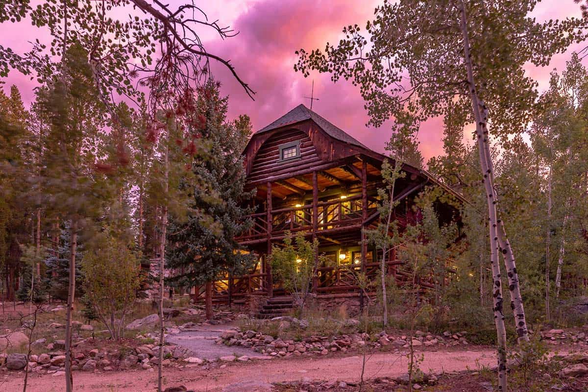 log cabin exterior at dusk