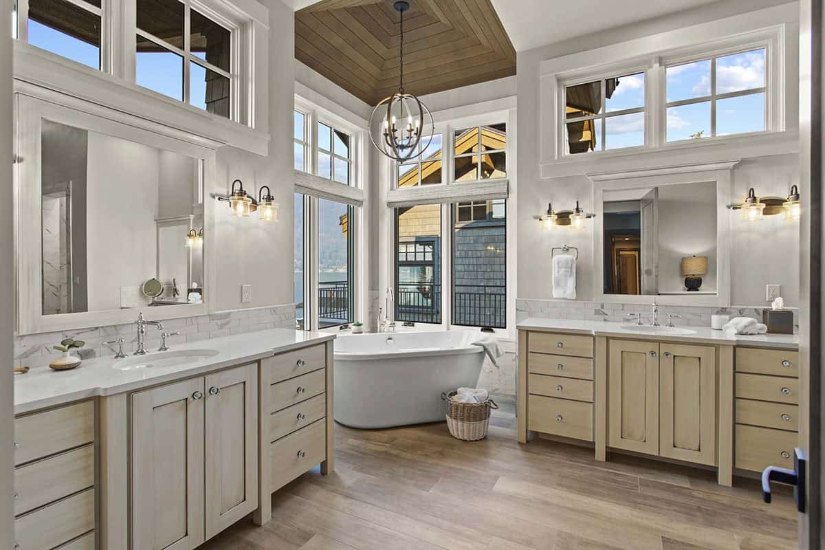 contemporary bathroom with dual vanities and a freestanding tub