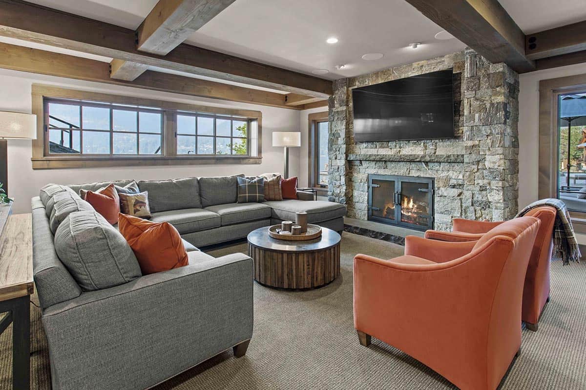 contemporary family room with a fireplace