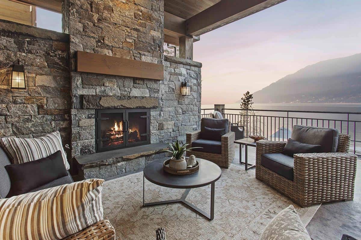 contemporary covered patio with a fireplace and outdoor furniture