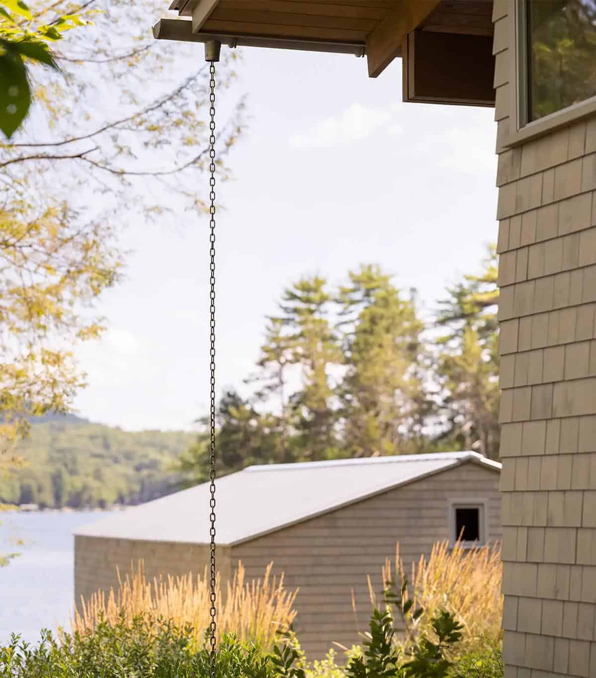 lake house exterior with a rain chain