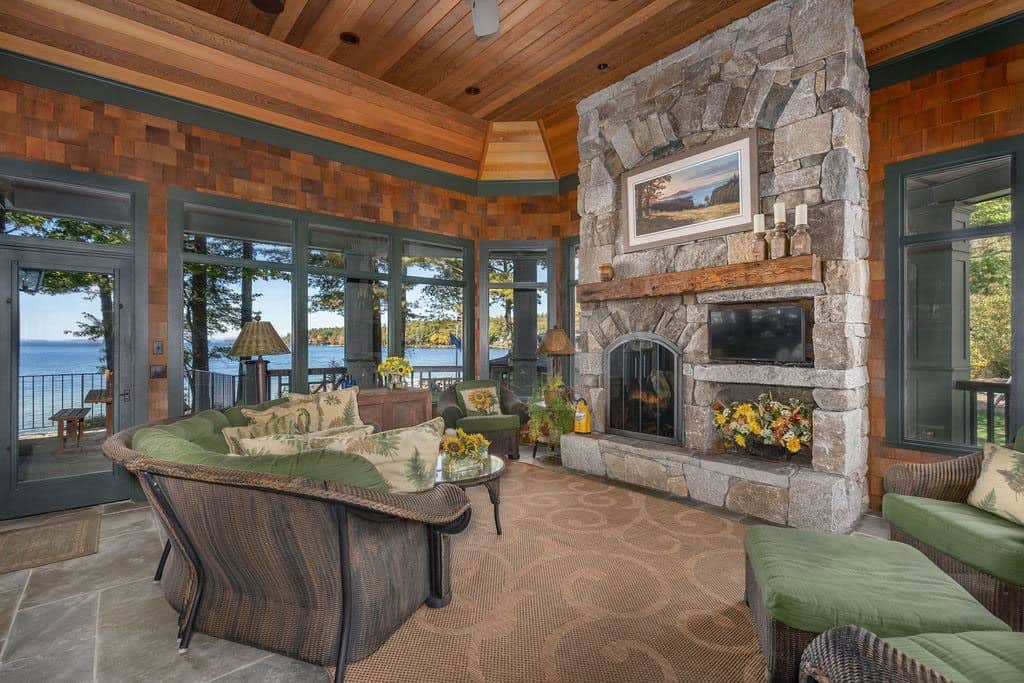traditional style screened porch with a fireplace
