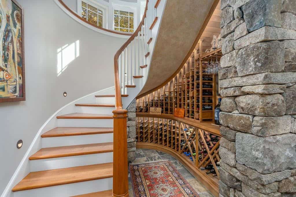 traditional style staircase with a wine cellar