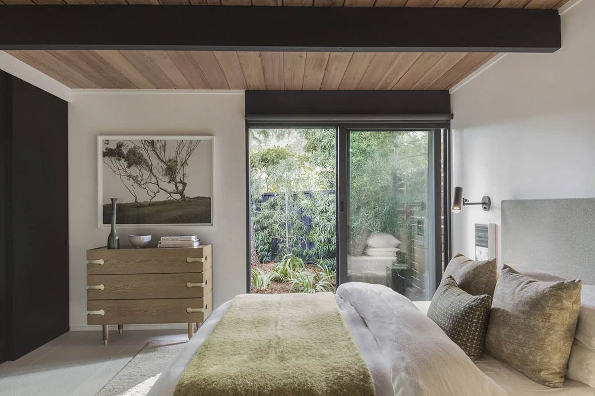 midcentury modern bedroom with a sliding glass door