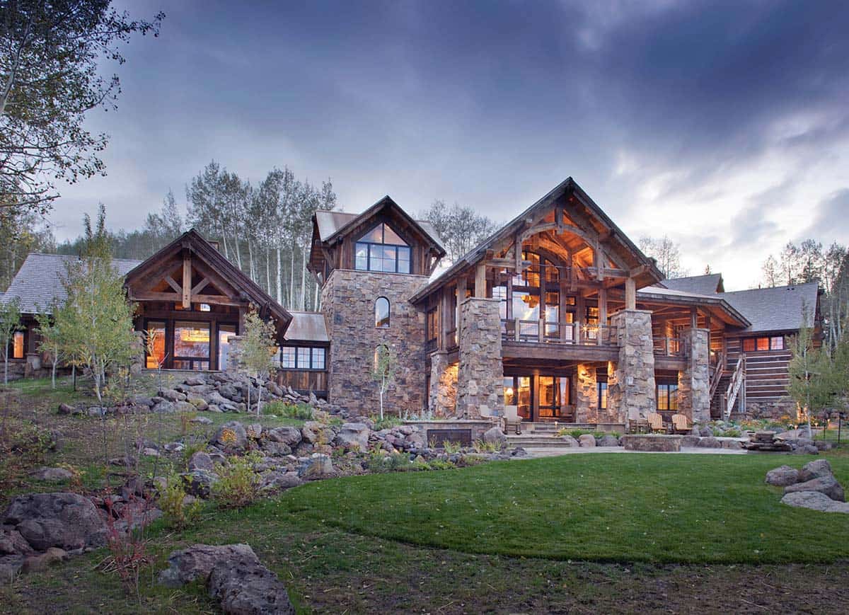 rustic mountain home exterior at dusk