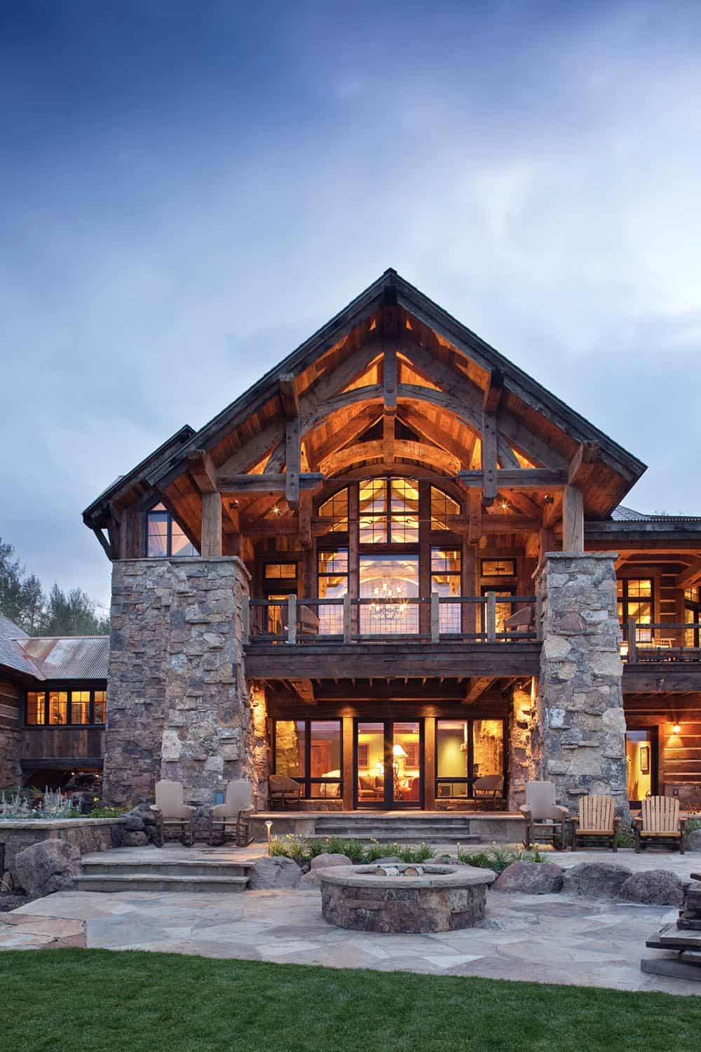 rustic mountain home exterior at dusk