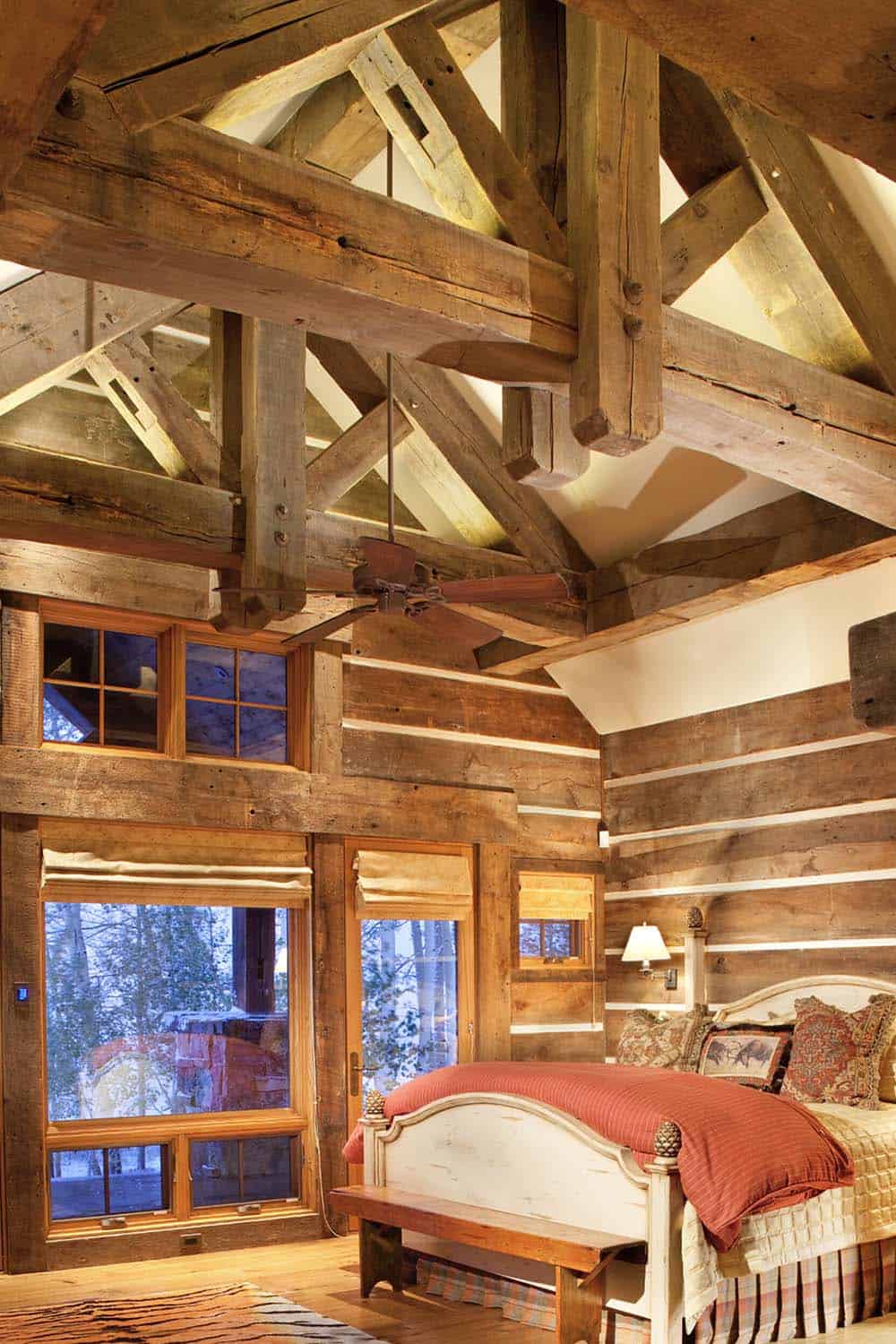 rustic bedroom with wood ceiling trusses