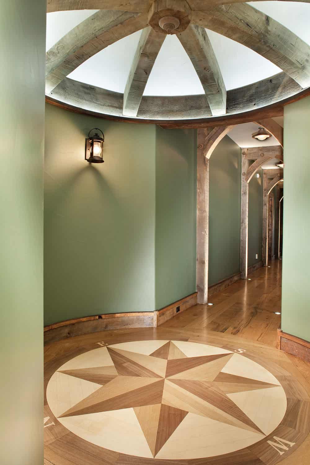 rustic hallway with a large, circular compass rose inlay.
