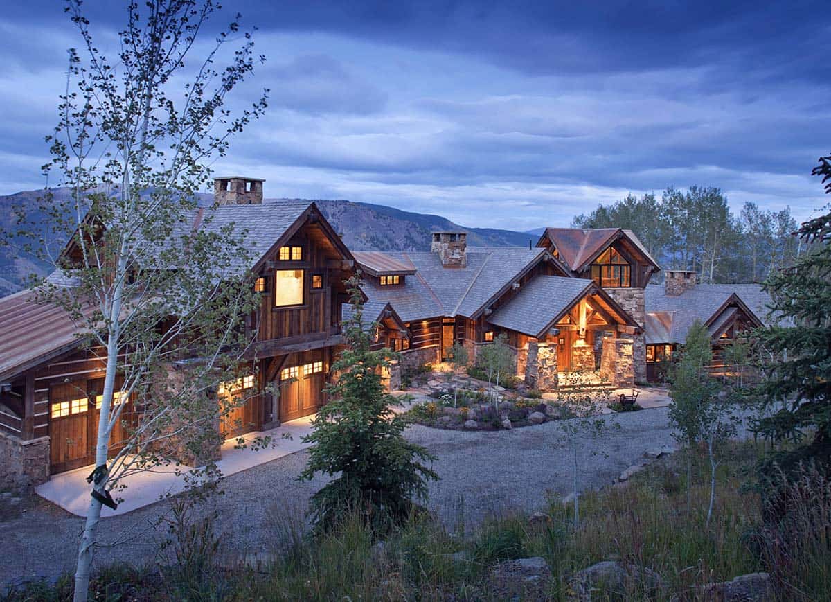 rustic mountain home exterior at dusk