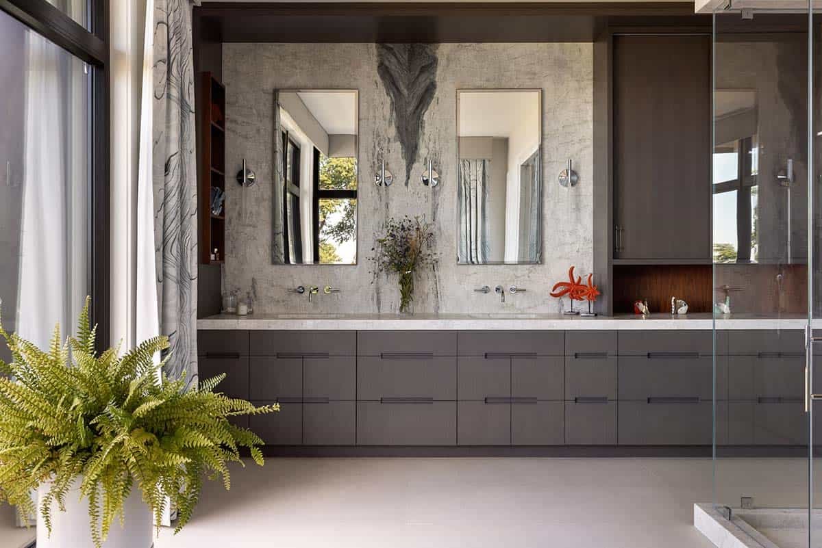 modern bathroom with bookmatched quartzite backplash and custom vanity