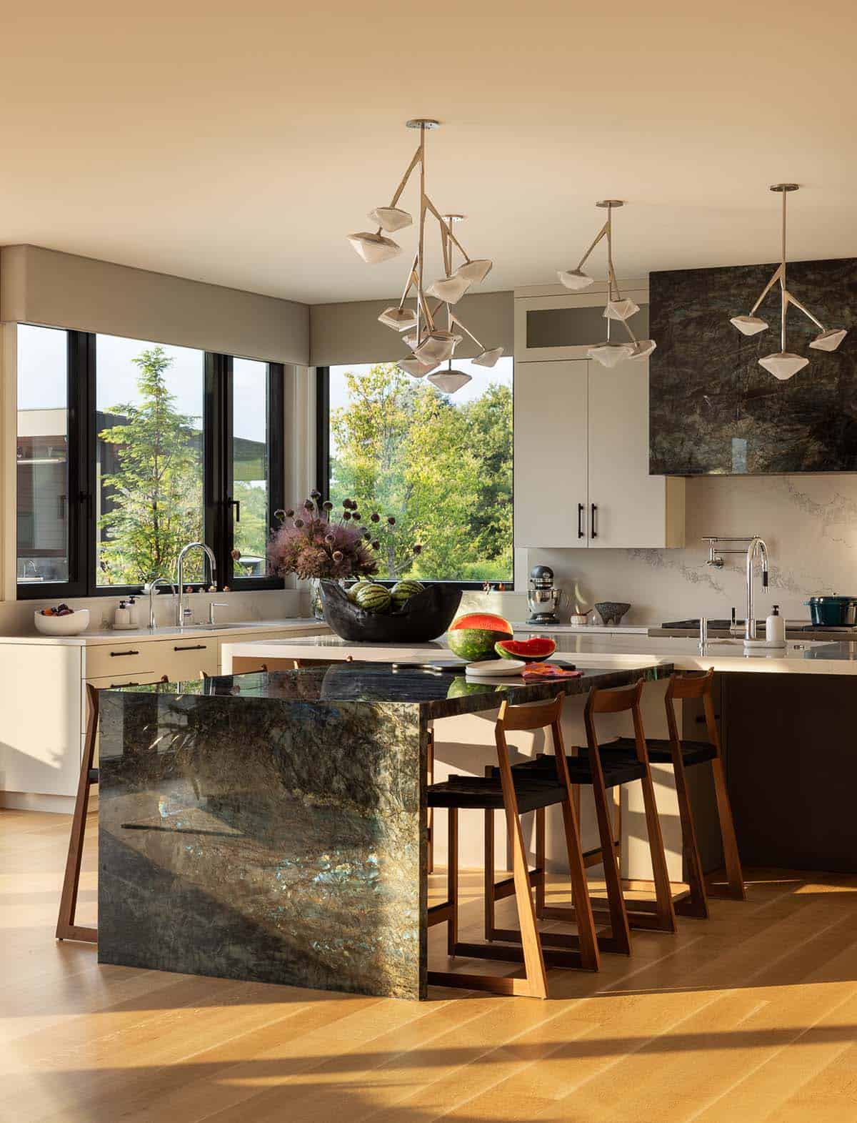 modern open plan kitchen with a waterfall Labradorite stone island