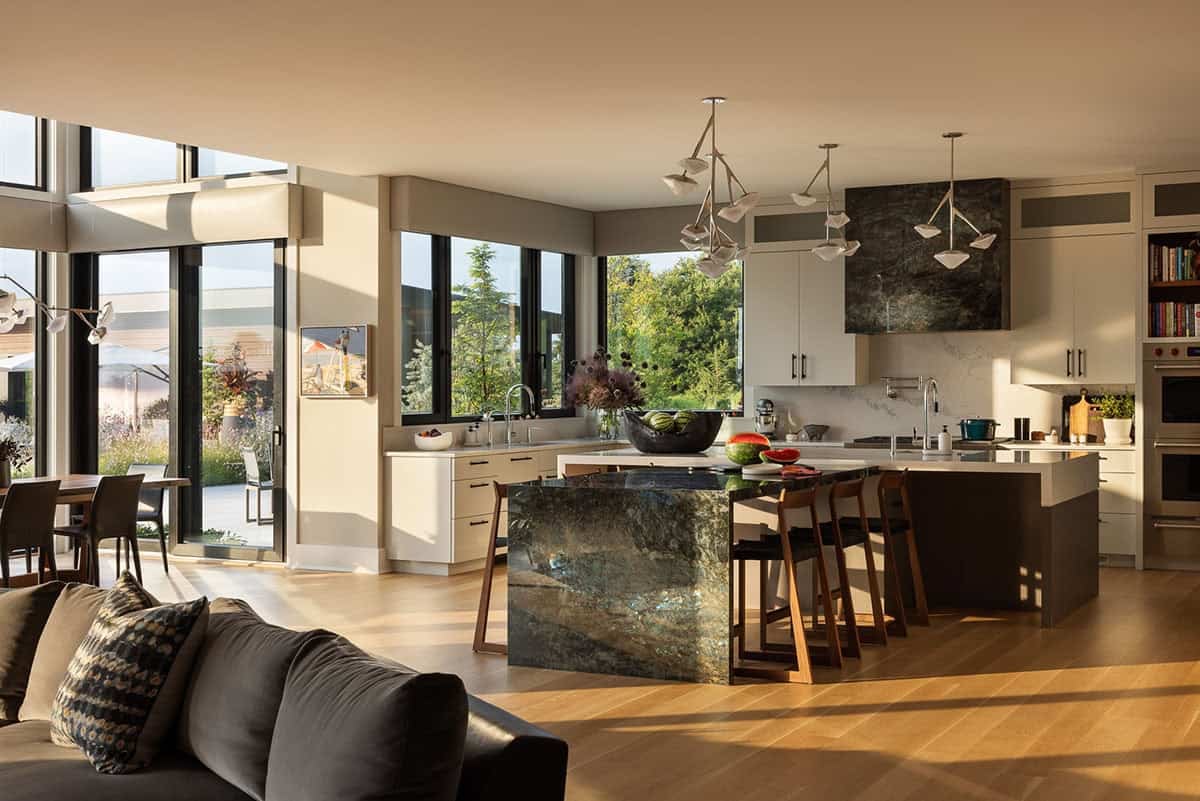 modern open plan kitchen with a waterfall Labradorite stone island