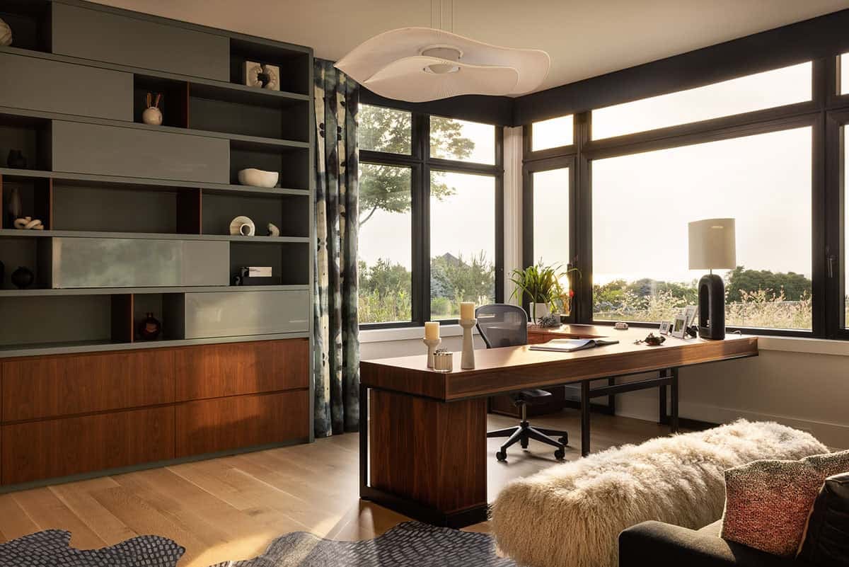 modern home office with custom shelving and sunset view