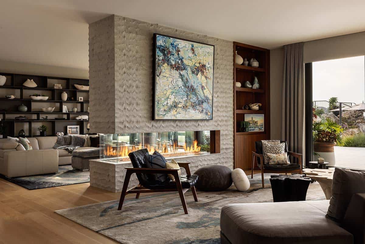 modern living room with a dual sided fireplace