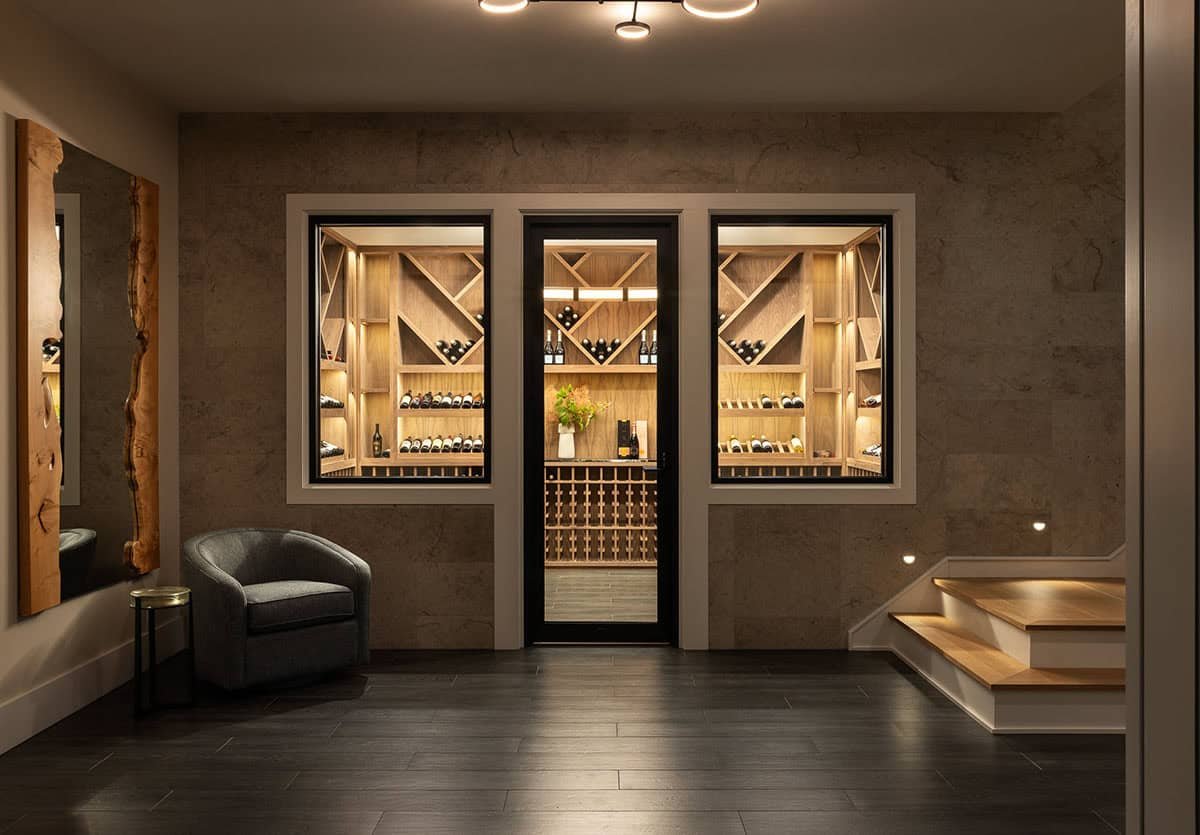 custom wine cellar with wood storage display and lounge