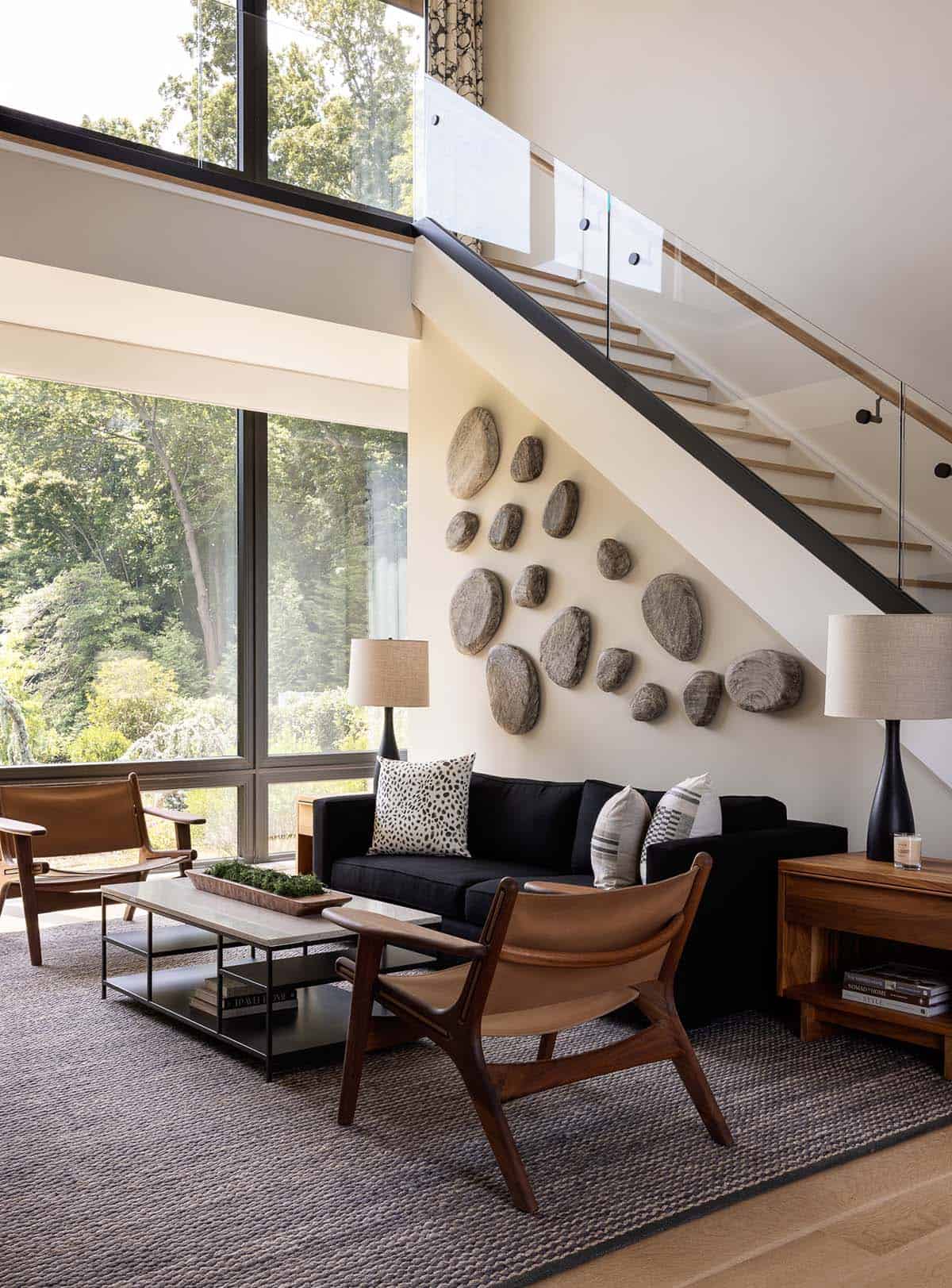 living room with a sculptural stone wall biophilic design