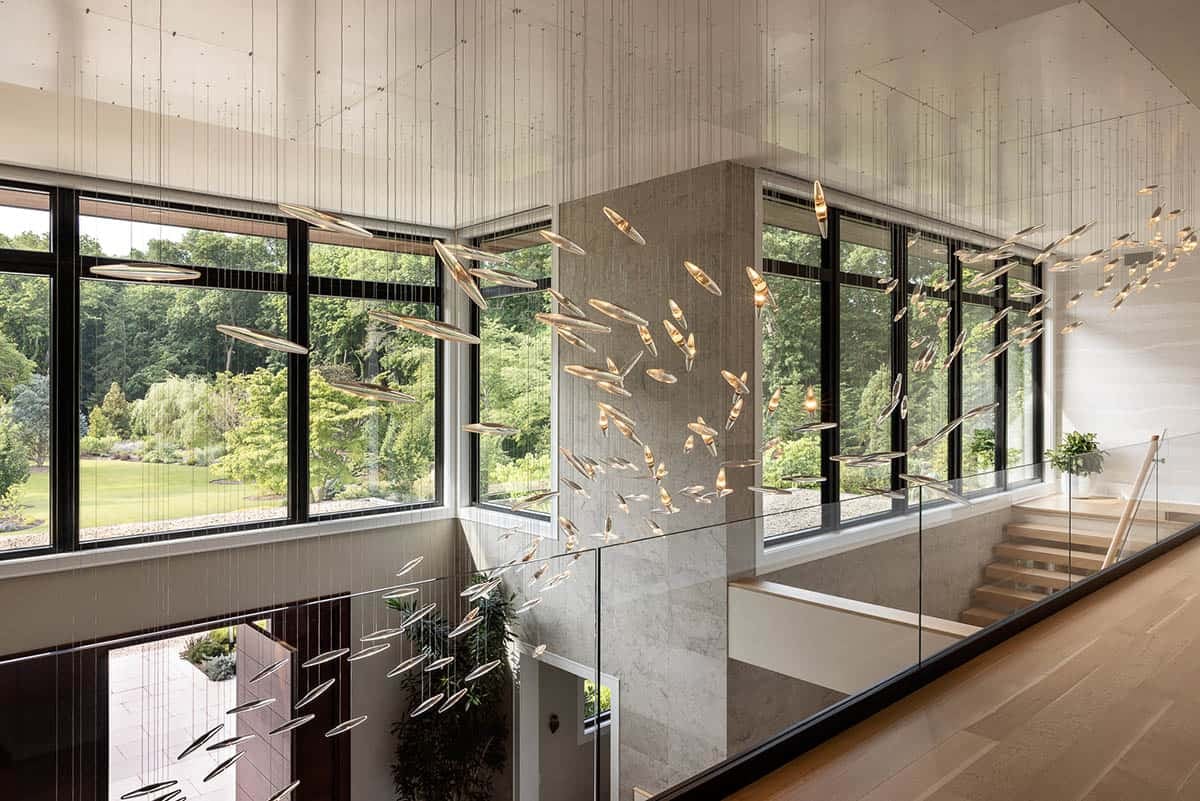 staircase with sculptural lighting