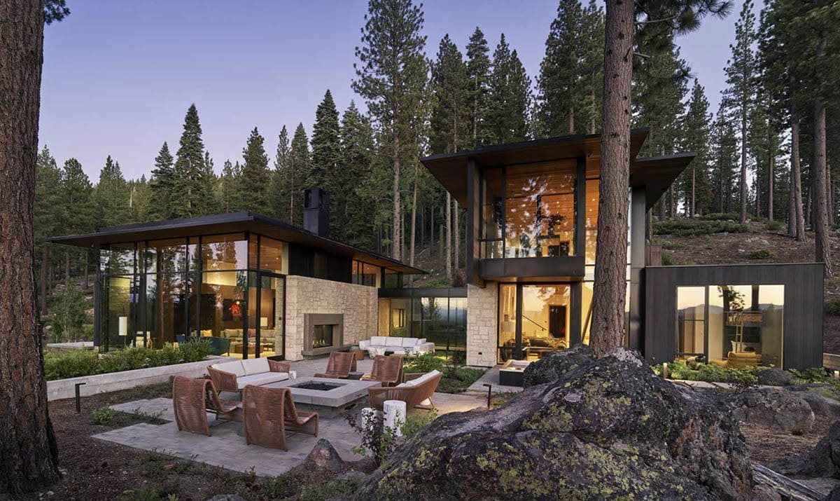 modern mountain house exterior backyard view with a patio and outdoor furniture