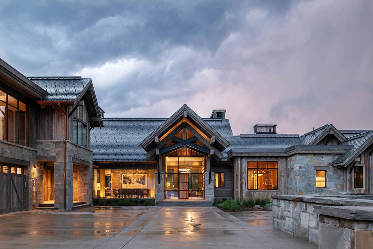 modern rustic home exterior at dusk