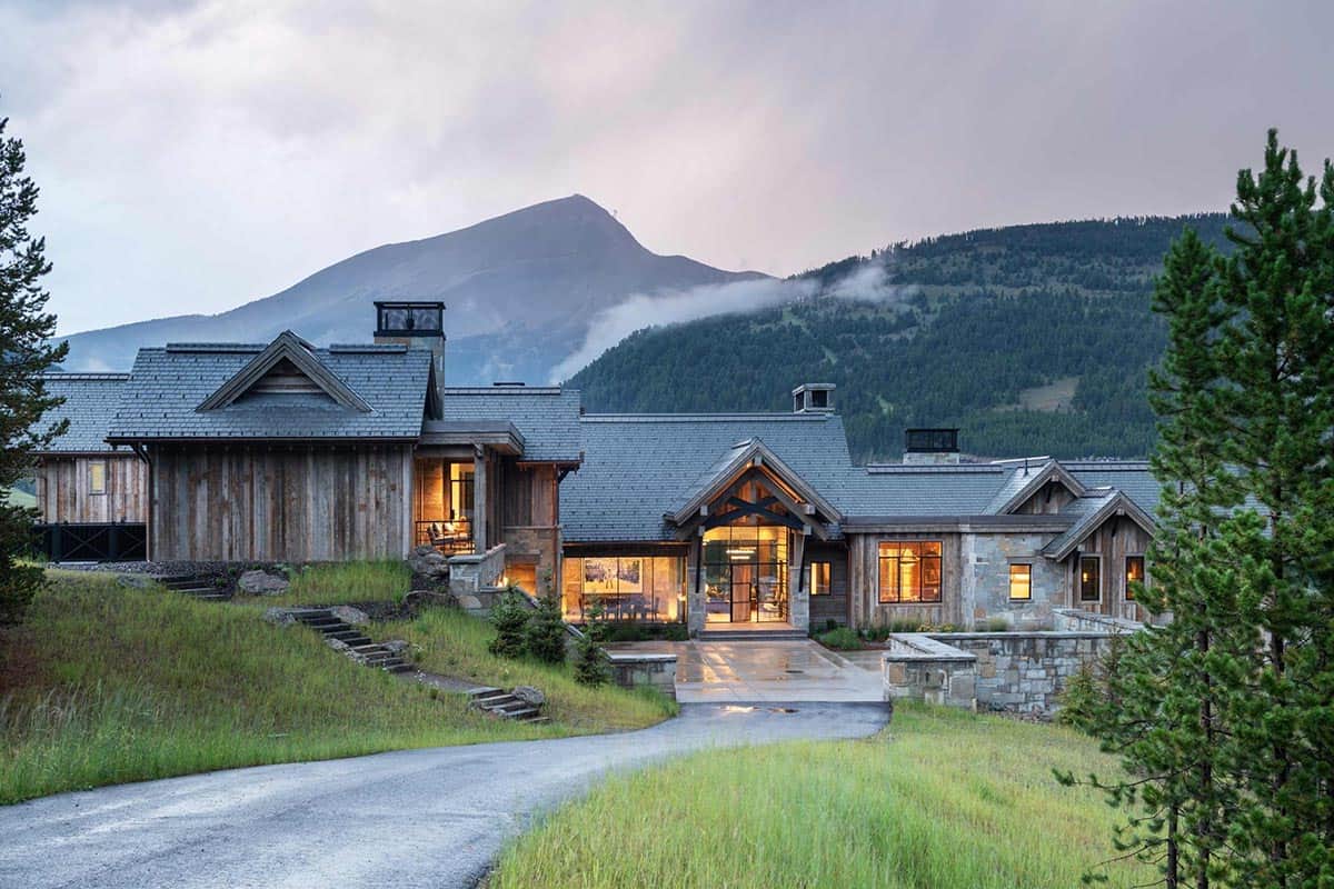 modern rustic home exterior at dusk