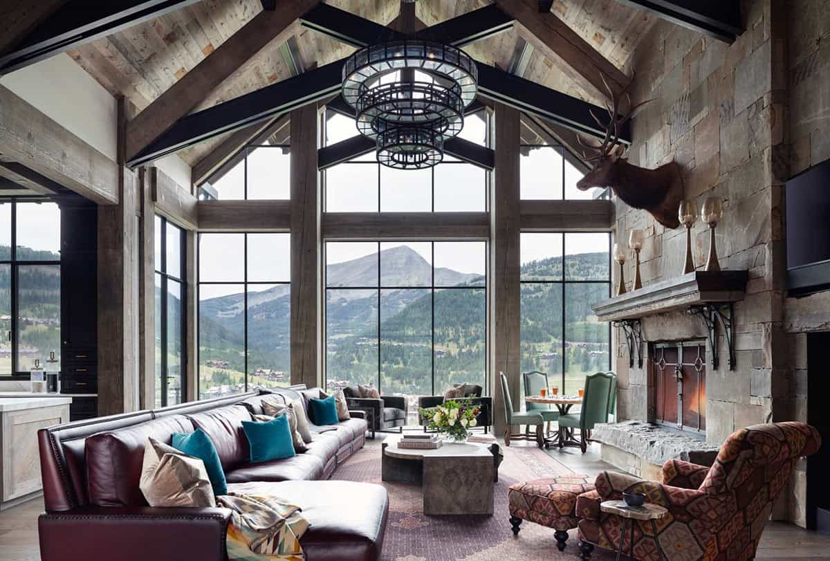 modern rustic living room with floor-to-ceiling windows and mountain views