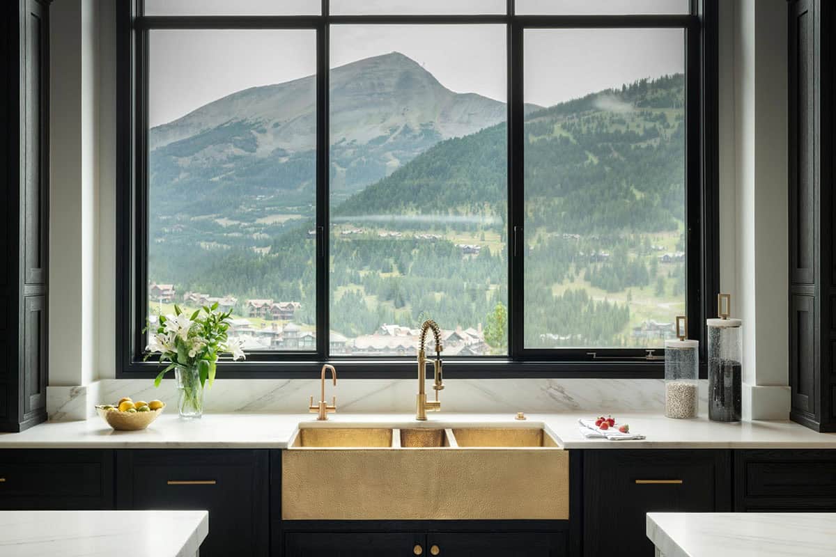 modern rustic kitchen with a sink and large picture window