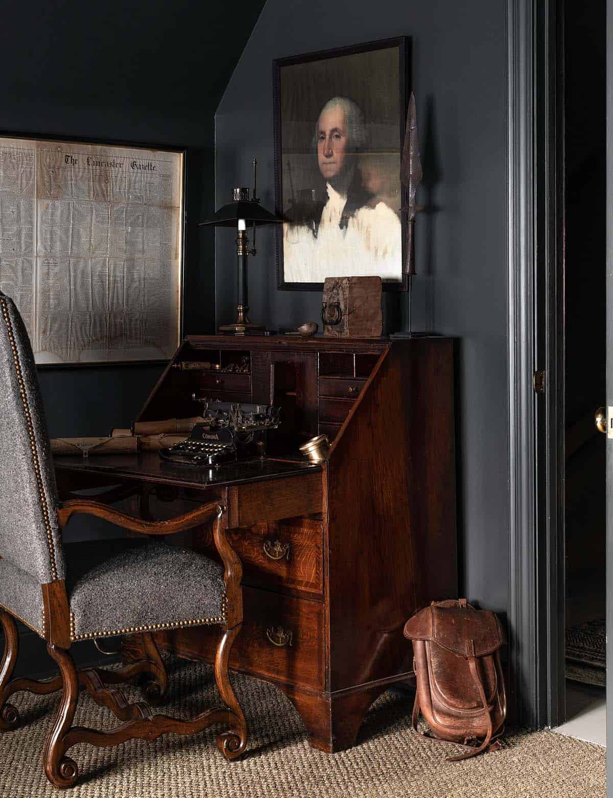 moody bedroom with a writing desk