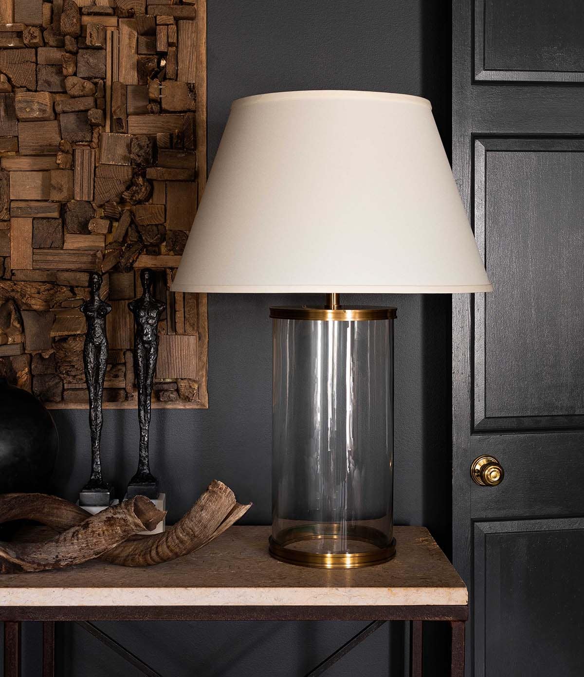 moody bedroom with a table and lamp
