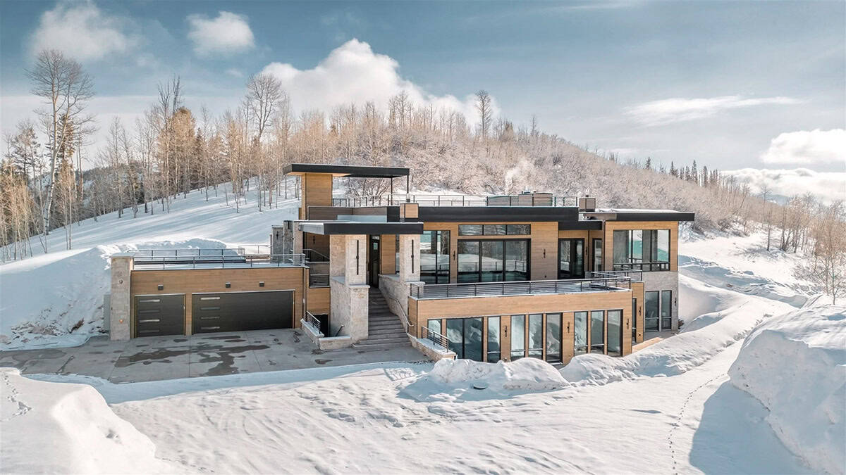 mountain modern home exterior with snow