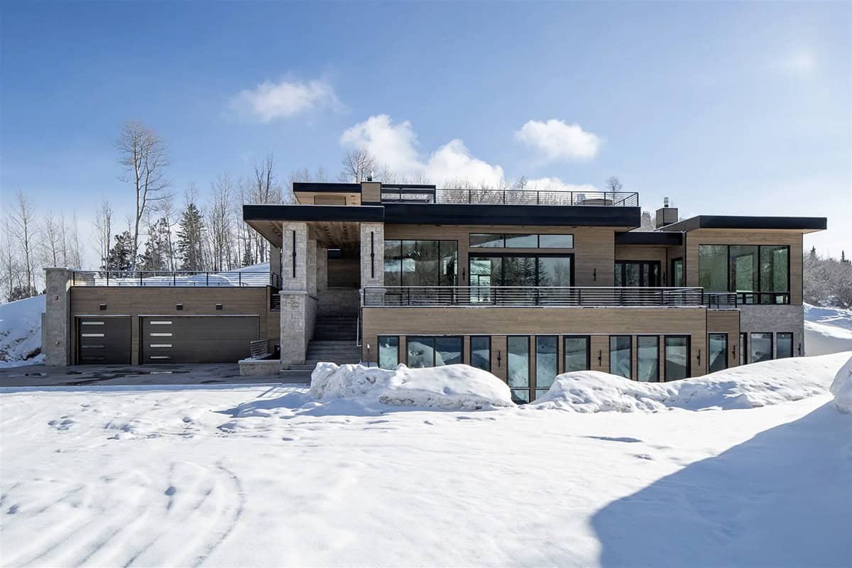 mountain modern home exterior with snow