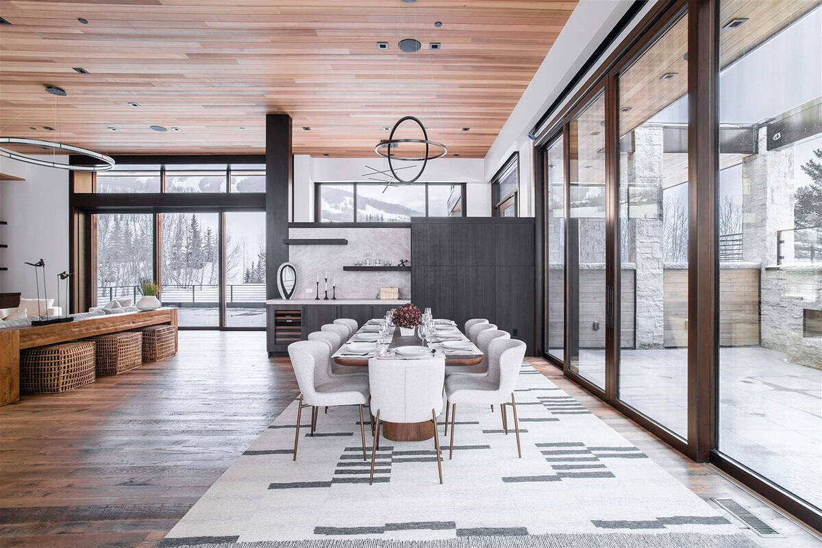 modern dining room room with large windows