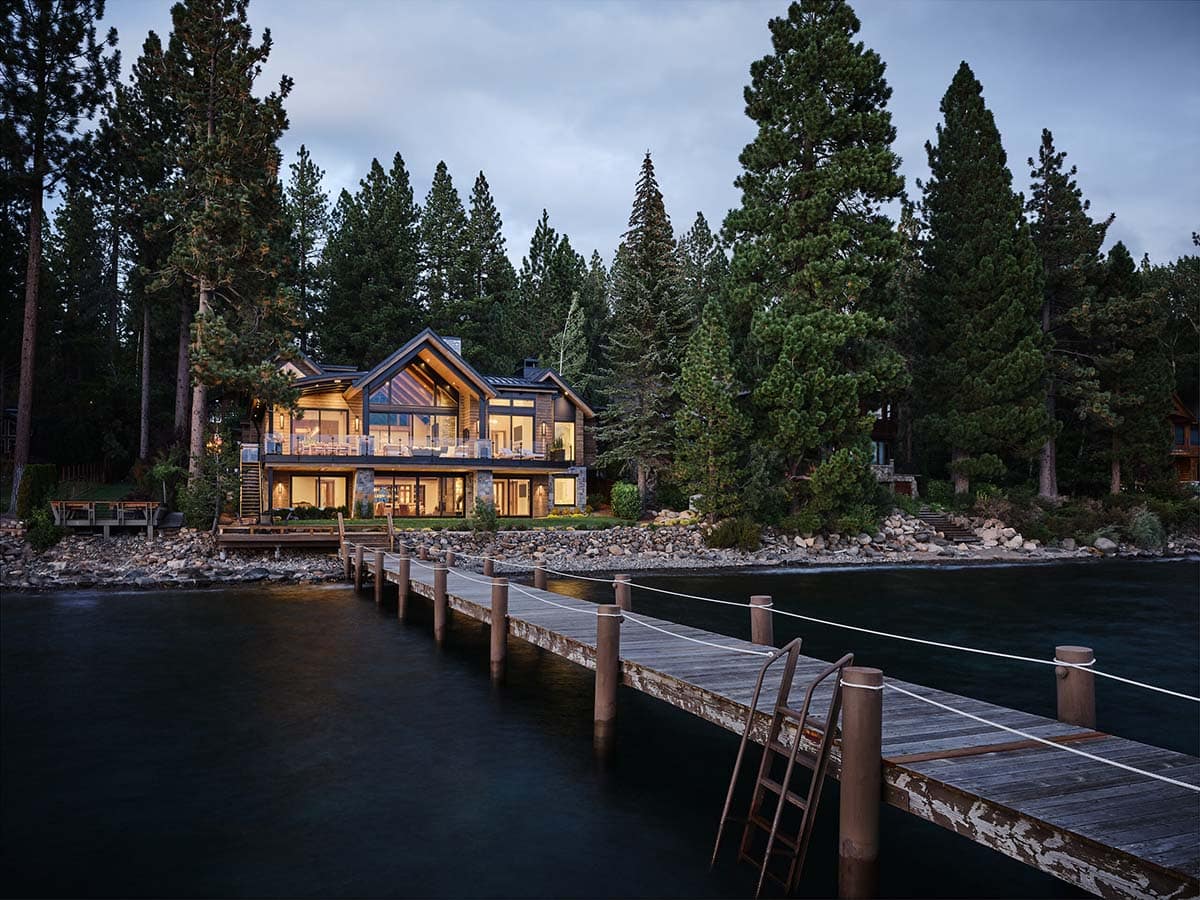 mountain modern lake house exterior at dusk