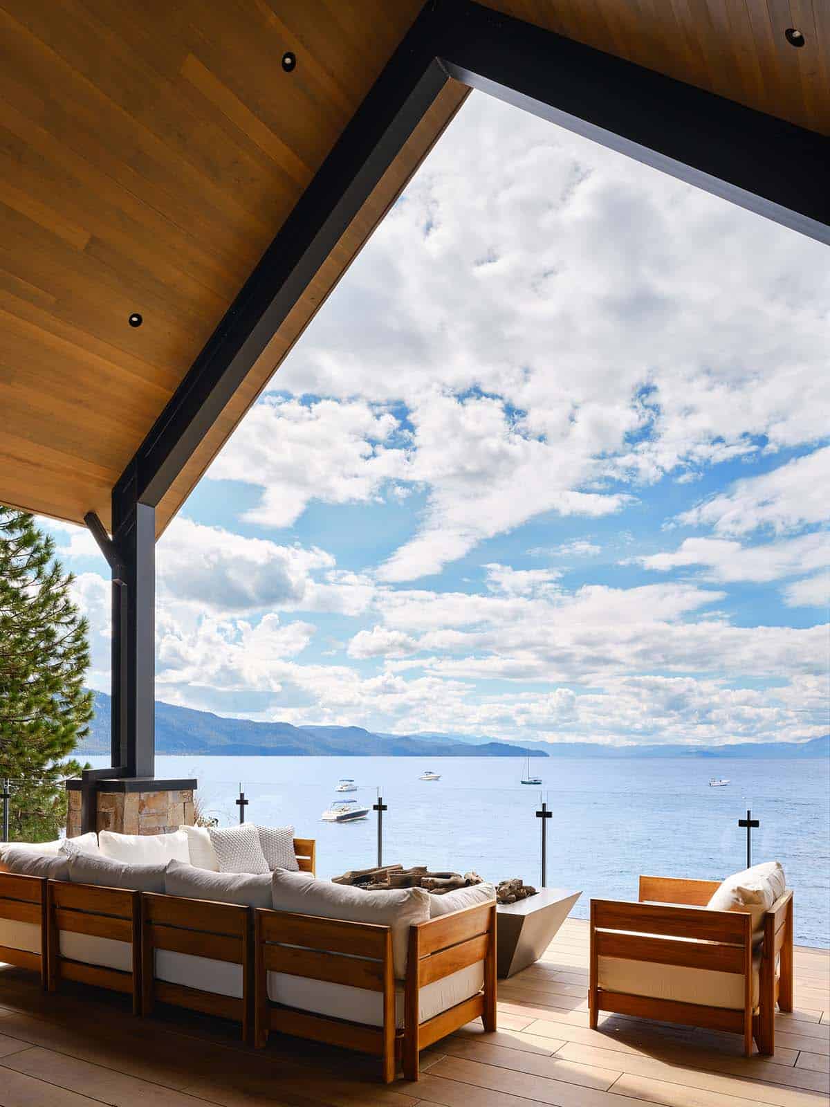 mountain modern covered patio with outdoor furniture and a lake view