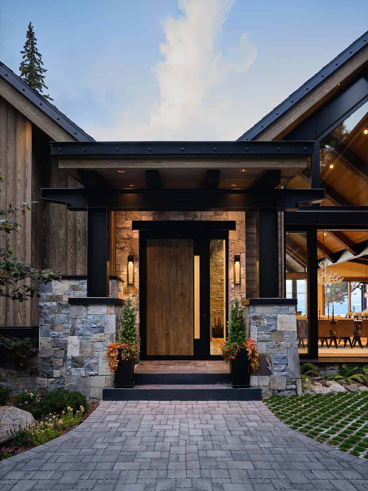 mountain modern lake house exterior entrybat dusk