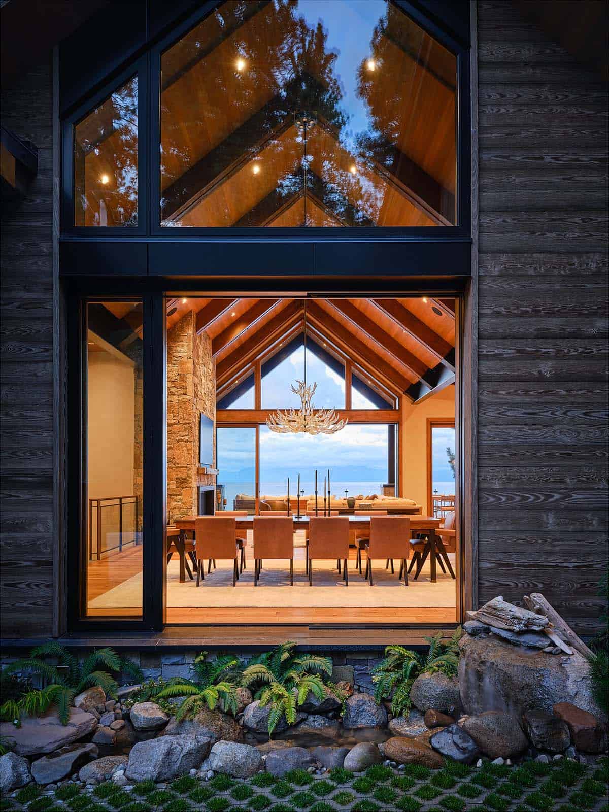 mountain modern lake house exterior at dusk
