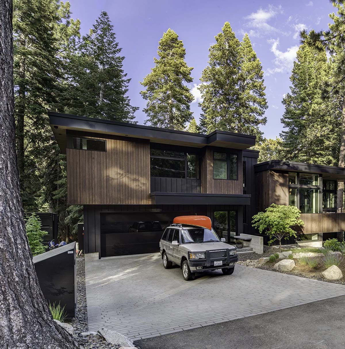 Image showcasing Mountain modern house nestled on an idyllic forested property in Lake Tahoe