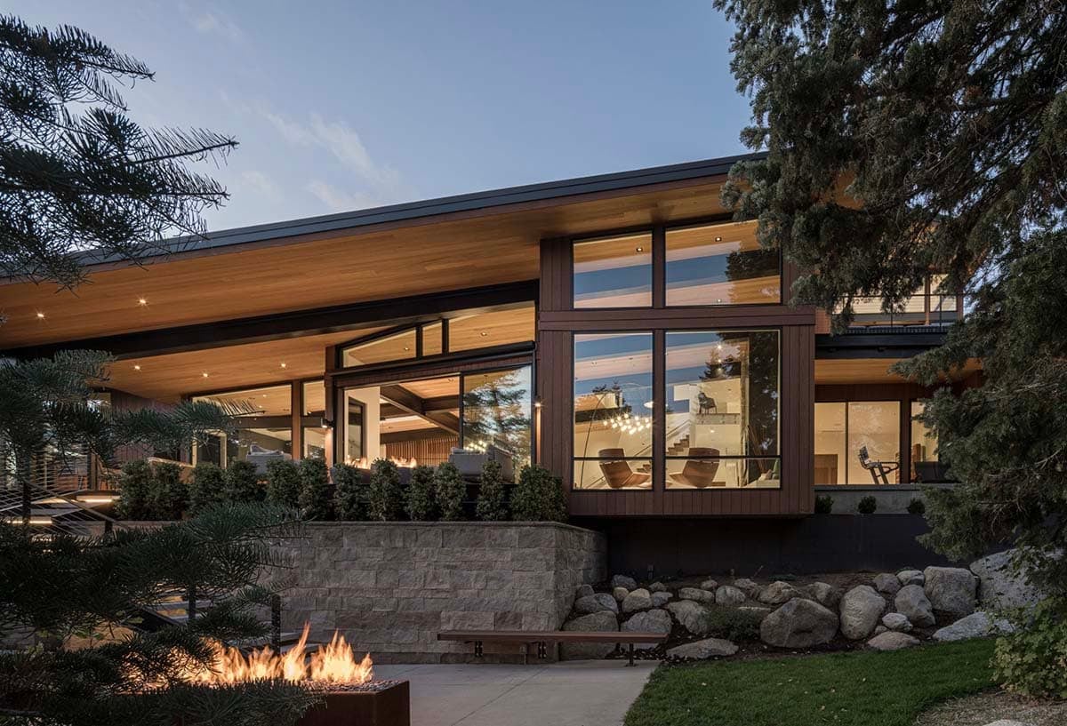 mountain modern home exterior patio with a fire pit