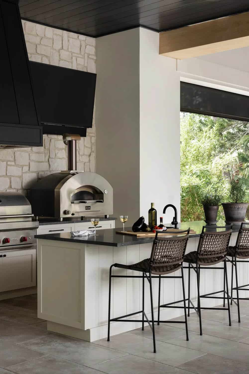 organic modern covered porch with a kitchen