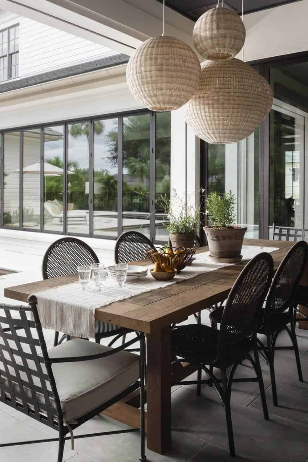 organic modern covered porch with a dining room