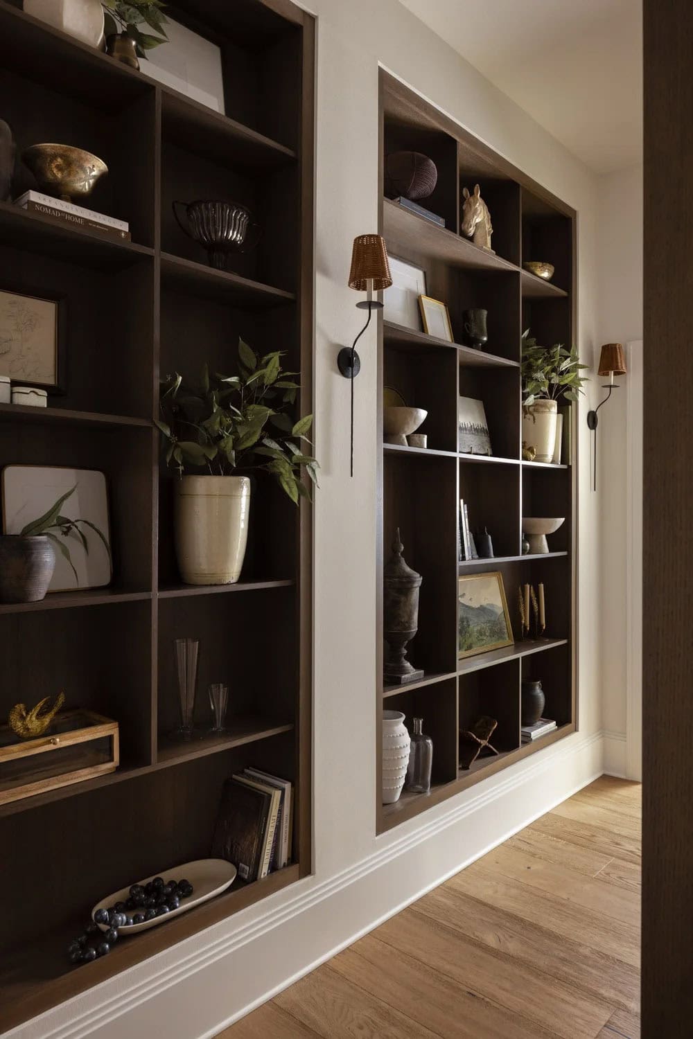 organic modern hallway with built-in bookshelves