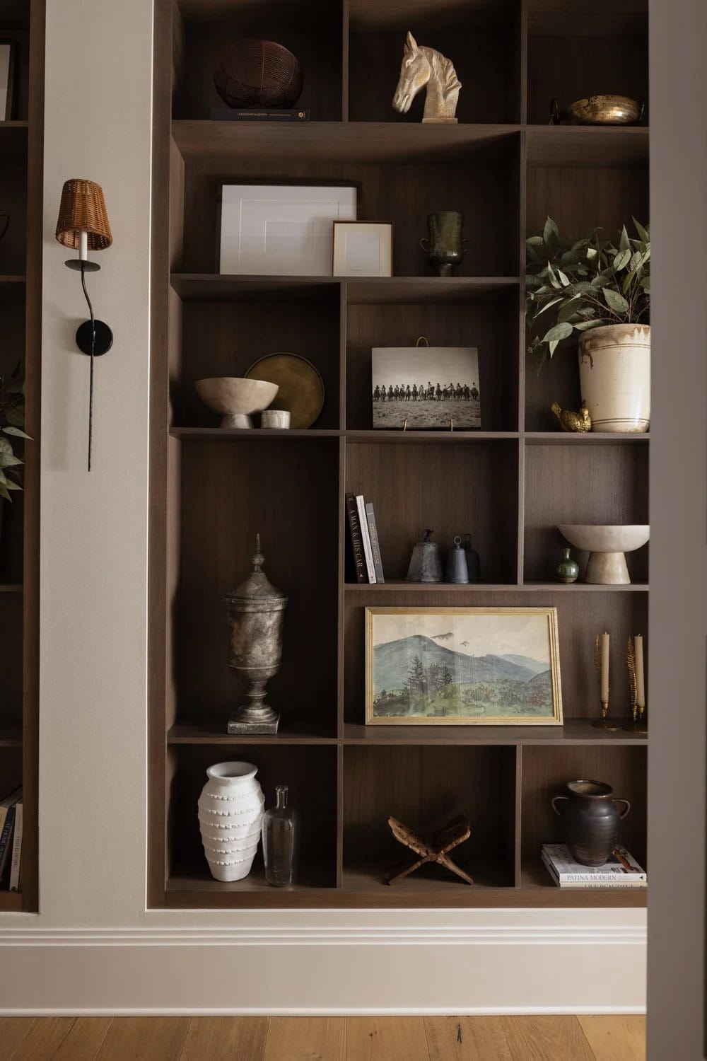 organic modern hallway with built-in bookshelves