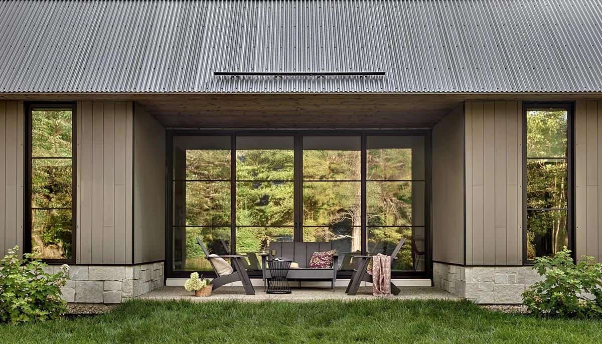 modern home exterior with a patio and outdoor furniture