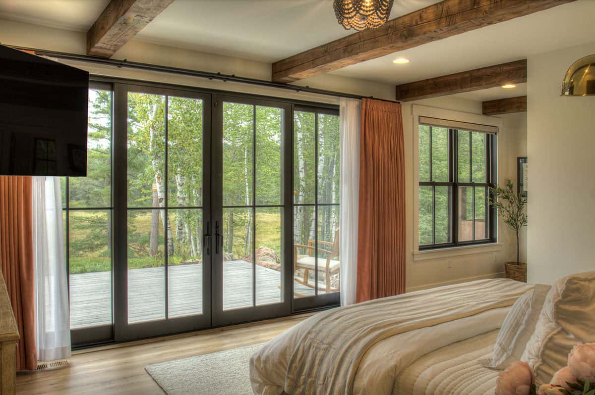 farmhouse style bedrom with floor-to-ceiling windows