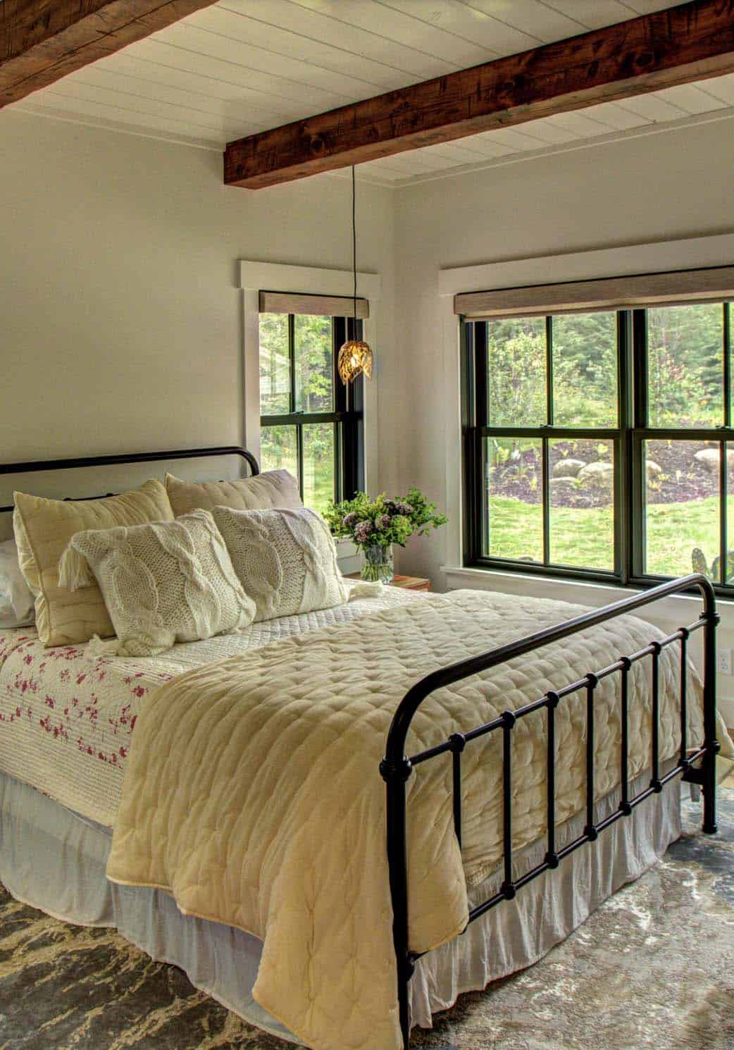 farmhouse style bedrom with an iron bed